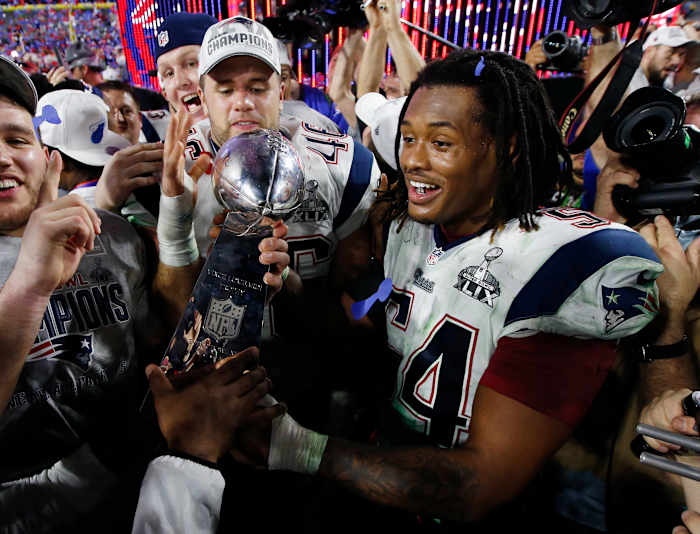 New England Patriots linebacker Dont'a Hightower celebrates with the Vince Lombardi Trophy after defeating the Seattle Seahawks in Super Bowl XLIX at University of Phoenix Stadium.